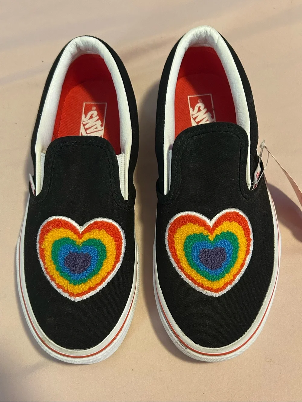 Vans Kids Black Slip-On Sneakers with Rainbow Heart Patch